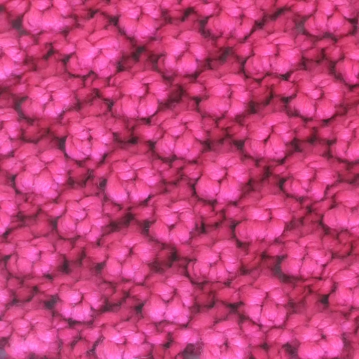 Raspberry Stitch knitted with pink color yarn.