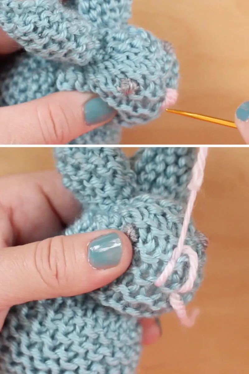 Embroidering a bunny face with yarn and a tapestry needle.