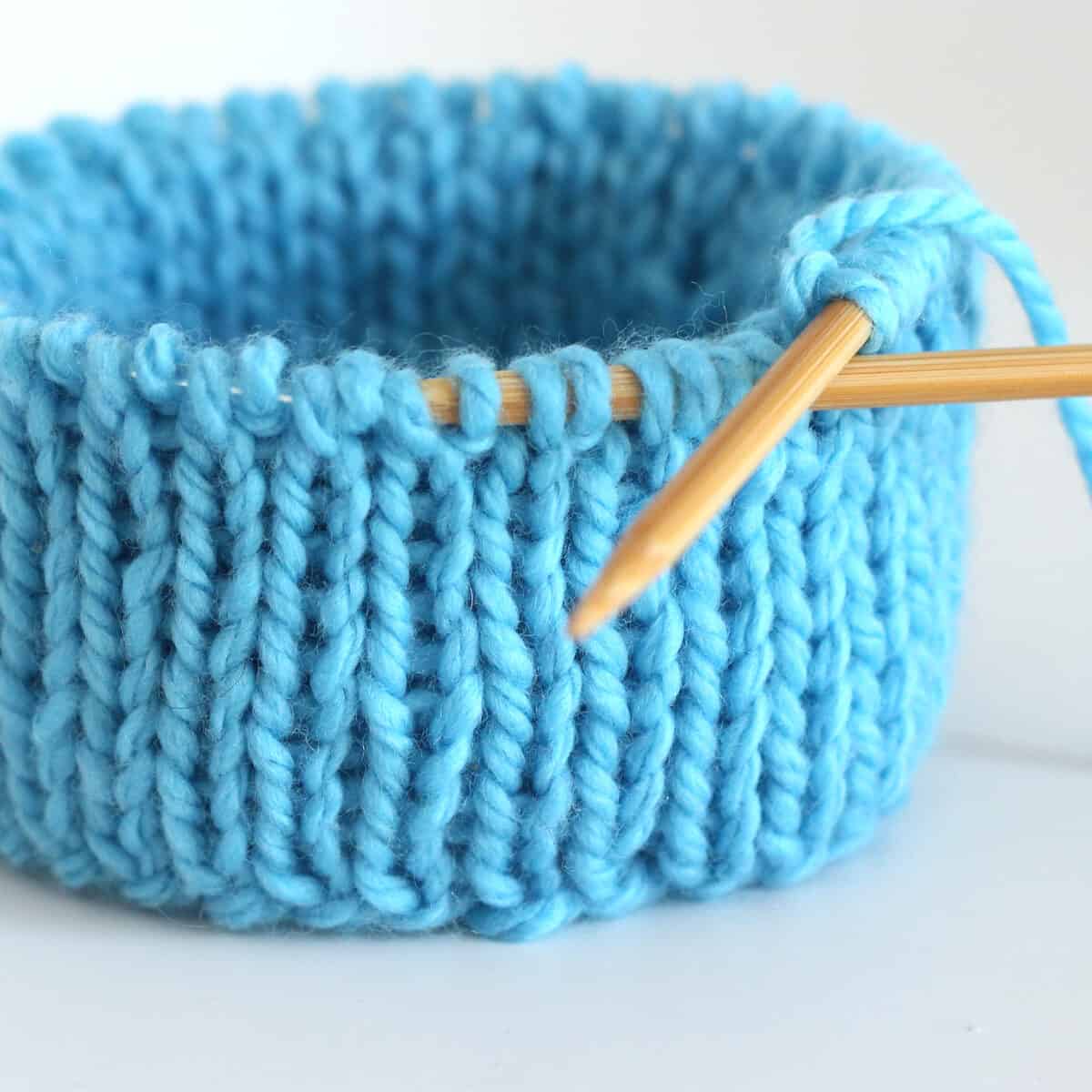 Double Stockinette stitch knitted in the round on circular needles in blue color yarn.