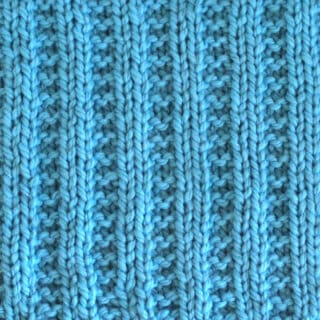 Garter Ribbing Knit Stitch Pattern in blue color yarn.