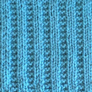 Garter Ribbing Knit Stitch Pattern in blue color yarn.