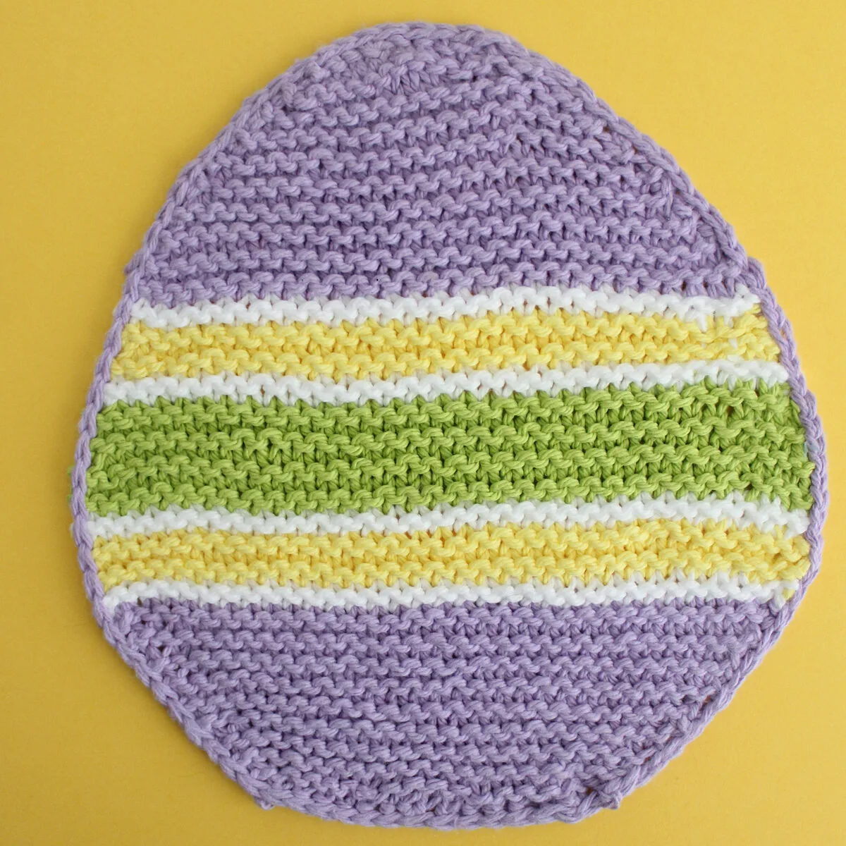 Easter Egg Dishcloth knitted with purple and yellow yarn colors.