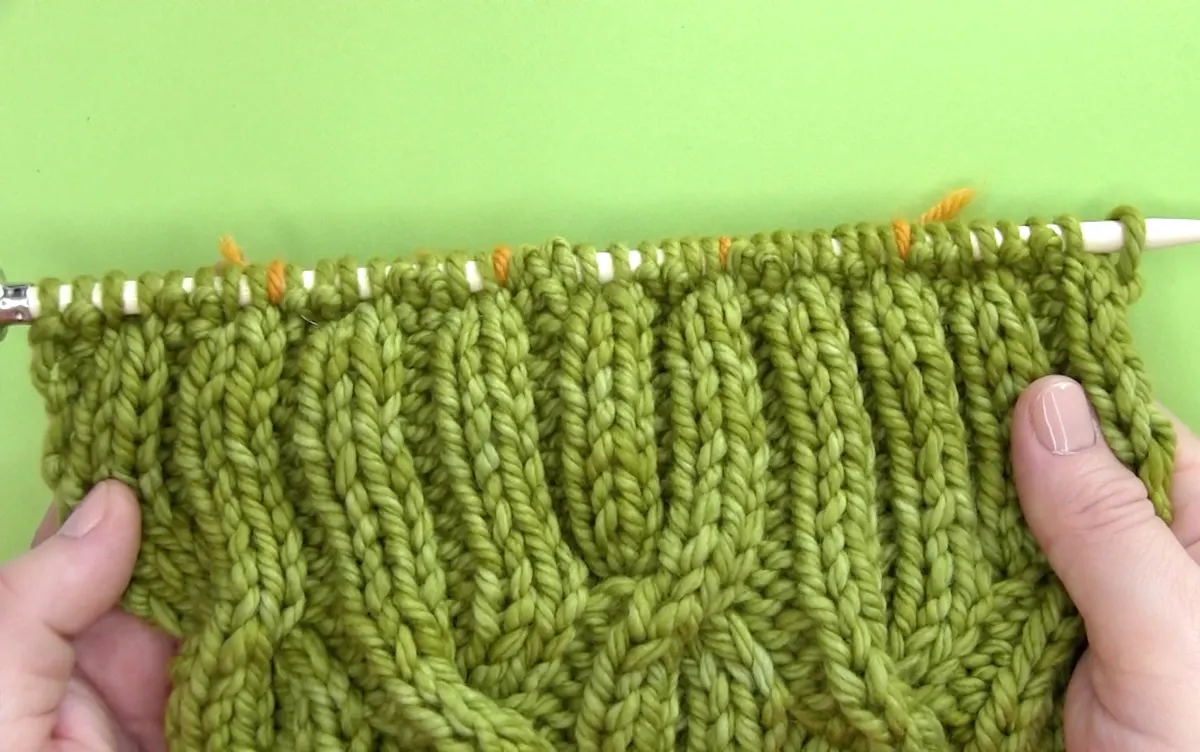 Finishing with 9 rows in 2x2 Rib Stitch for reversible cable scarf.
