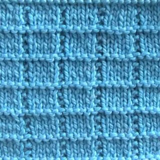 Tile Squares knit stitch pattern with blue colored yarn.