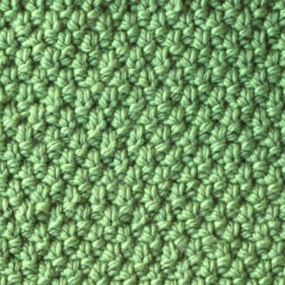 Irish Moss Knit Stitch pattern in green color yarn.