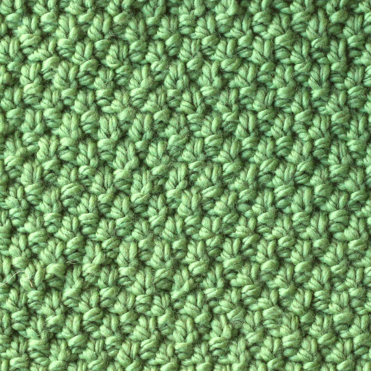 Irish Moss Knit Stitch pattern in green color yarn.