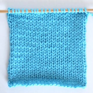 Stockinette stitch knitted flat on straight knitting needles.