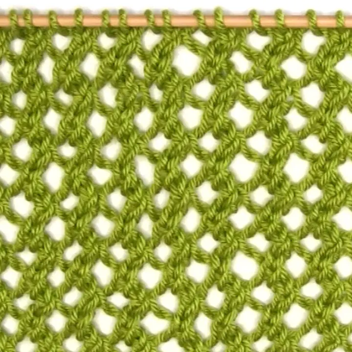 Mesh Lace knitting swatch in green color yarn.
