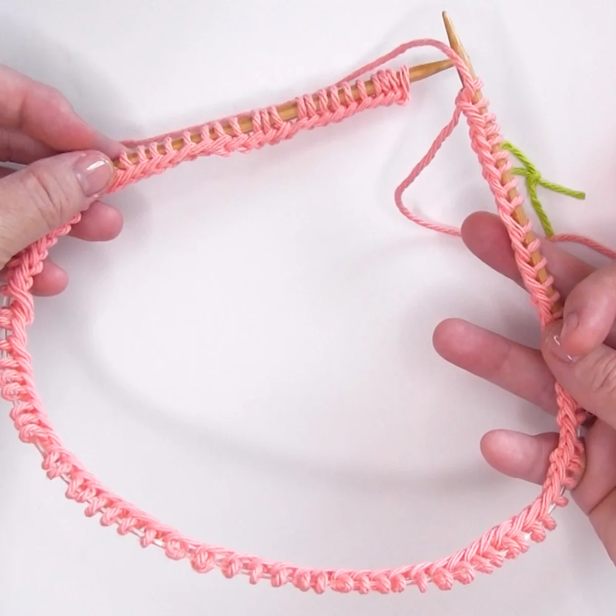 Casting on stitches onto a circular knitting needle.