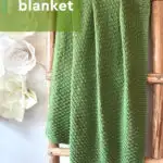 Easy Moss Blanket knitting pattern in green yarn color on wooden latter by Studio Knit.