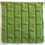 Bamboo Ribbing texture knitted in green colored yarn on bamboo needle.