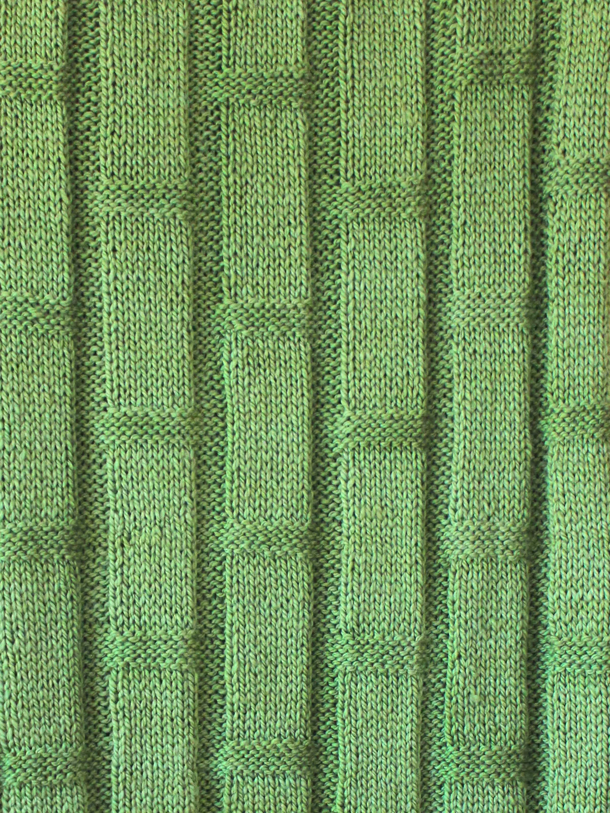 Knitted bamboo stitch with green yarn in large blanket pattern by Studio Knit.