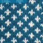 Fleur de Lys knit stitch pattern in blue and white color yarn by Studio Knit.