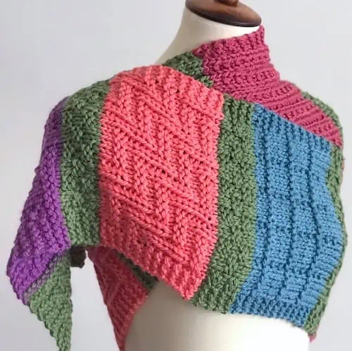 Color block scarf modeled on manequin.