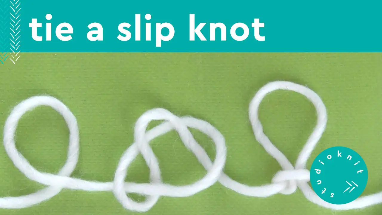 Tie a slip knot with white yarn demonstrating how to make.