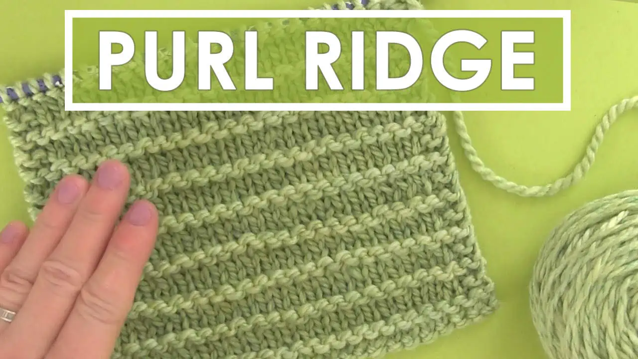 Purl Ridge knitting pattern in green yarn color with hand.