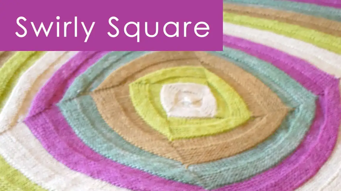 Swirly Square blanket knitted with multiple yarn colors.