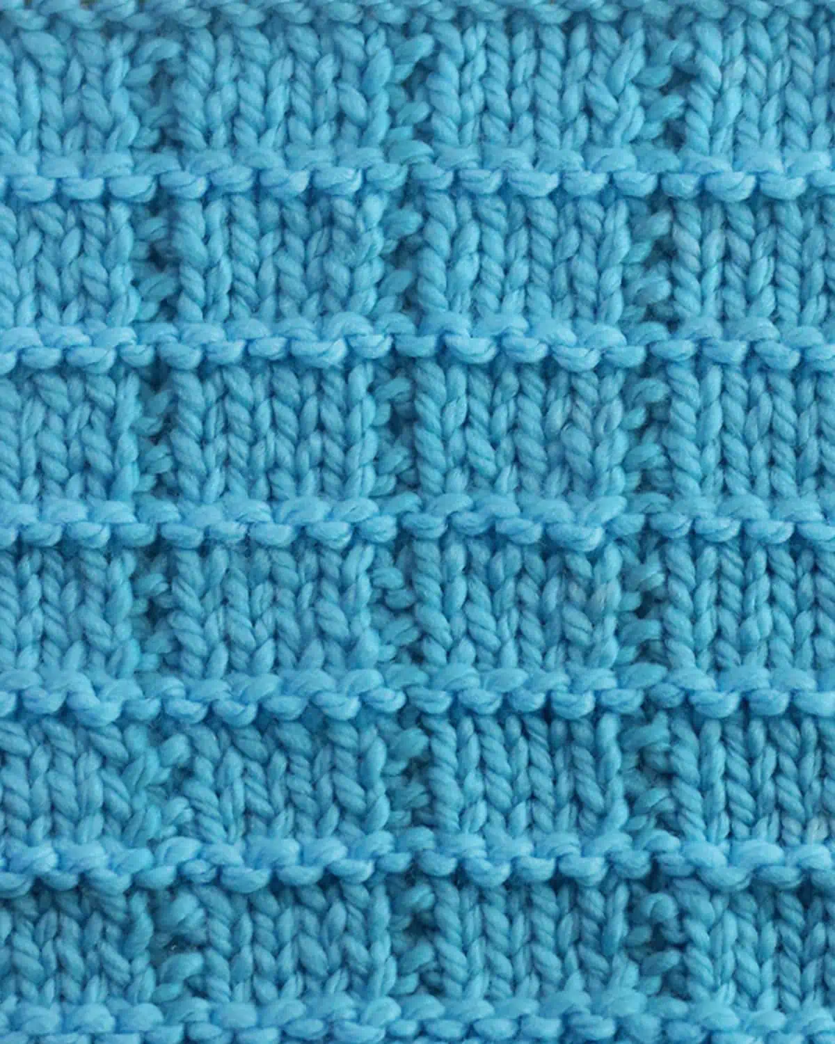Tile Square stitch texture knitted with blue colored yarn.