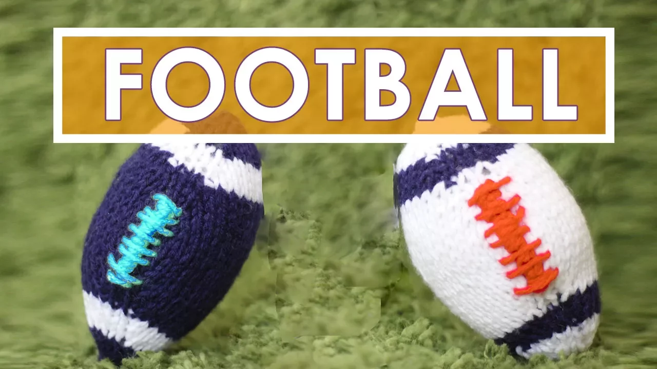 Two knitted footballs in blue and white yarn colors.