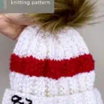 Taylor Swift's 87 Beanie Hat knitted in white and red yarn color by Studio Knit.