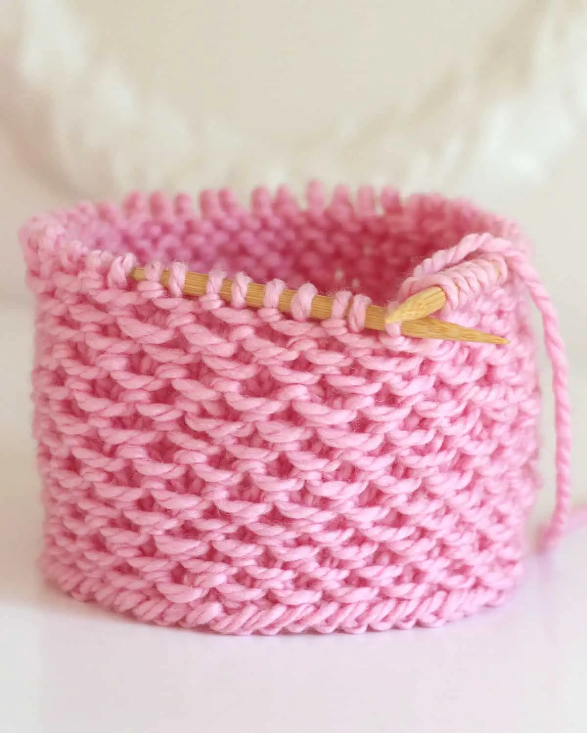 Stamen Stitch knitted in the round on circular needles with pink colored yarn.