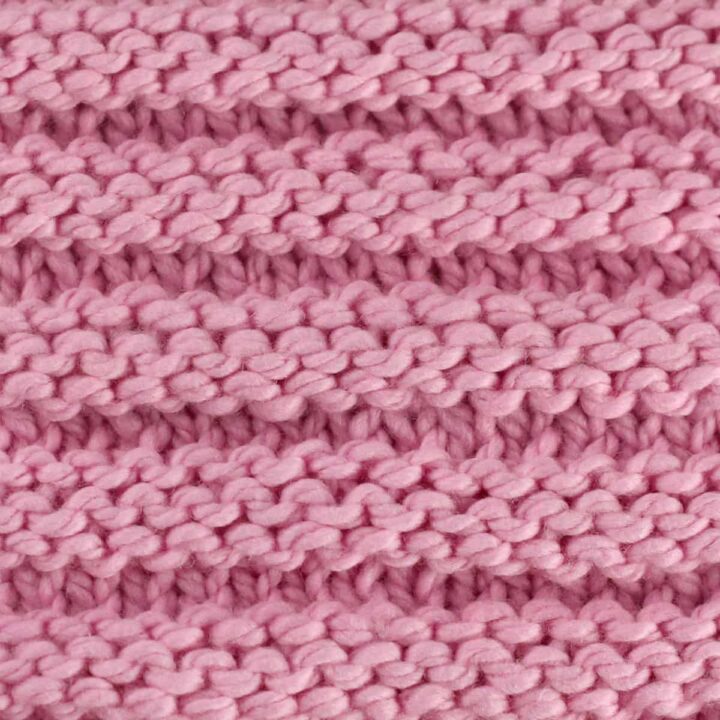 Reverse Ridge knit stitch texture in pink yarn color.