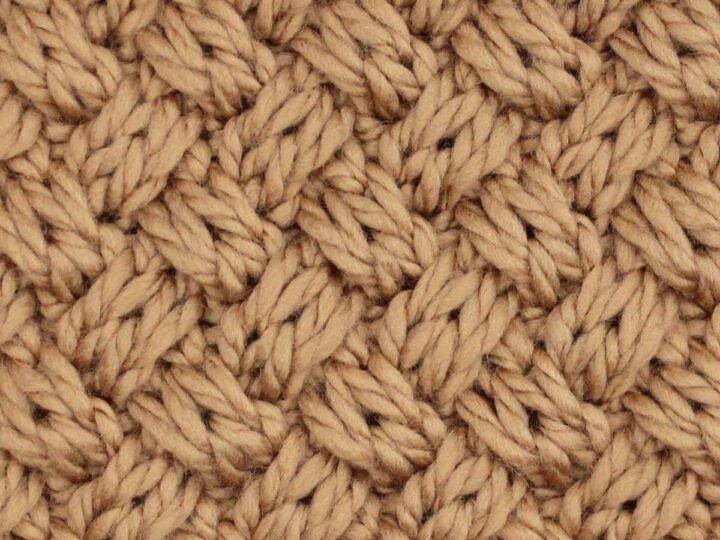 Swatch of the Diagonal Basket Weave Cable Stitch Knit Stitch Pattern in brown-colored yarn.
