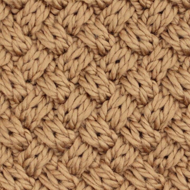Swatch of the Diagonal Basket Weave Cable Stitch Knit Stitch Pattern in brown-colored yarn.