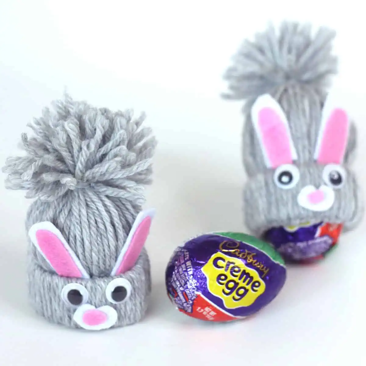 Yarn craft bunnies with a Cadbury creme egg.