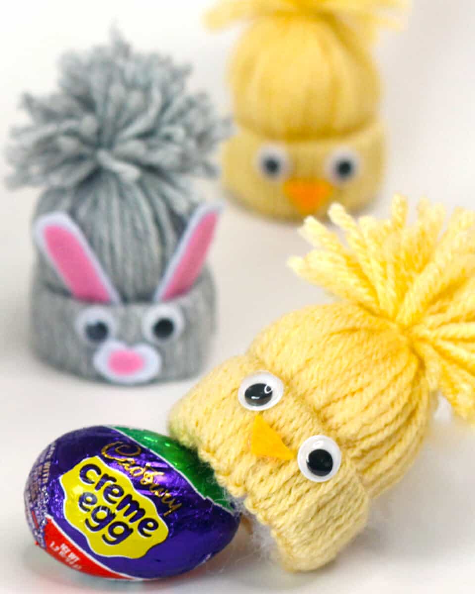 Yarn craft chicks and bunnies with a cadbury creme egg.