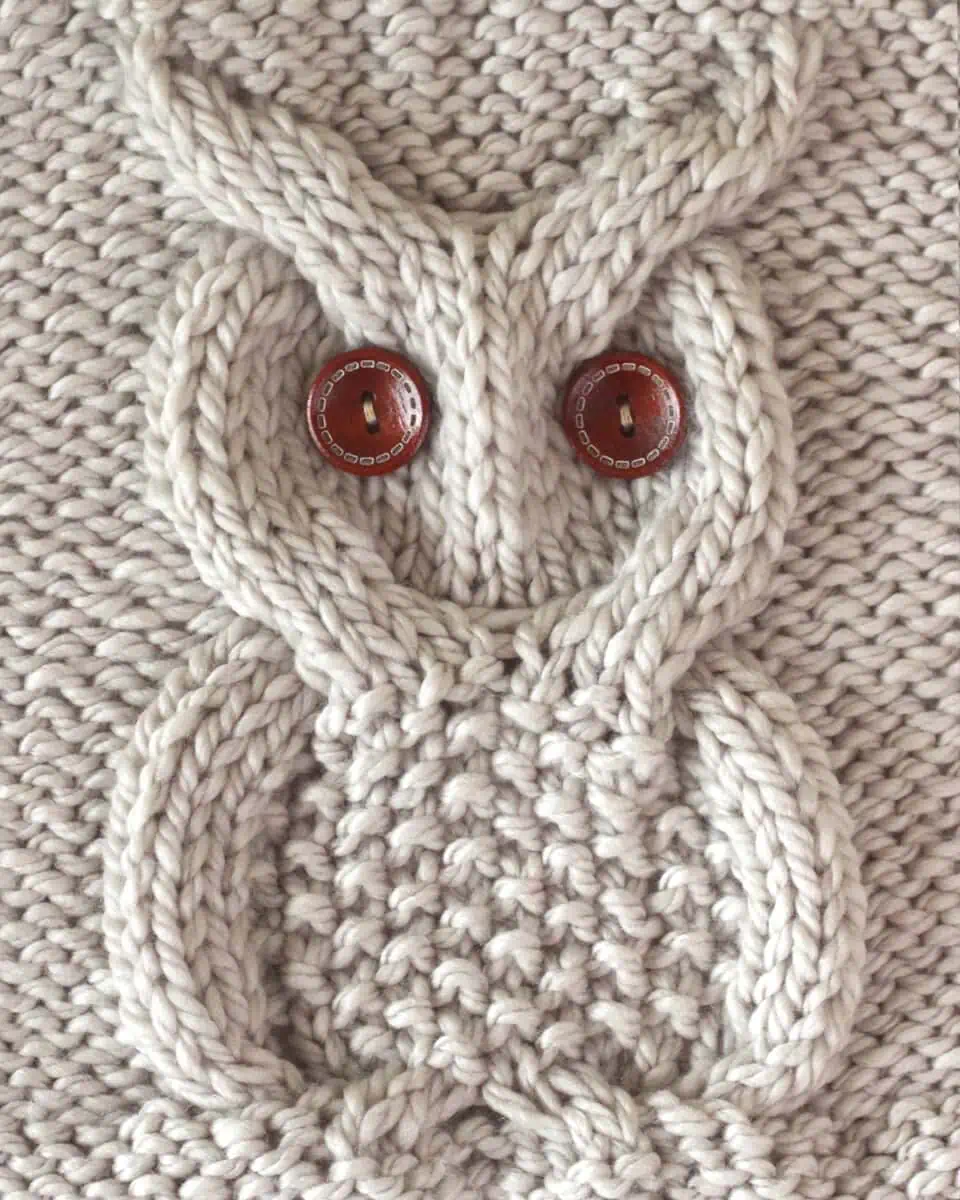 Owl Cable Stitch Square in beige yarn color with brown button eyes.