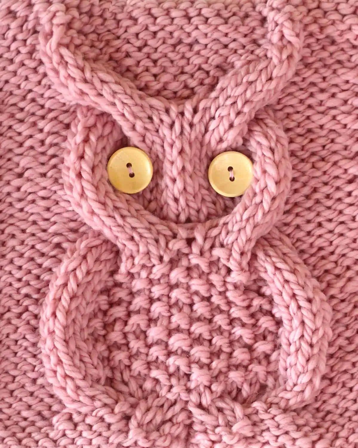 Owl Cable Stitch in pink yarn color with button eyes by Studio Knit.