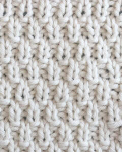 Swift Stitch knitting texture in white yarn.