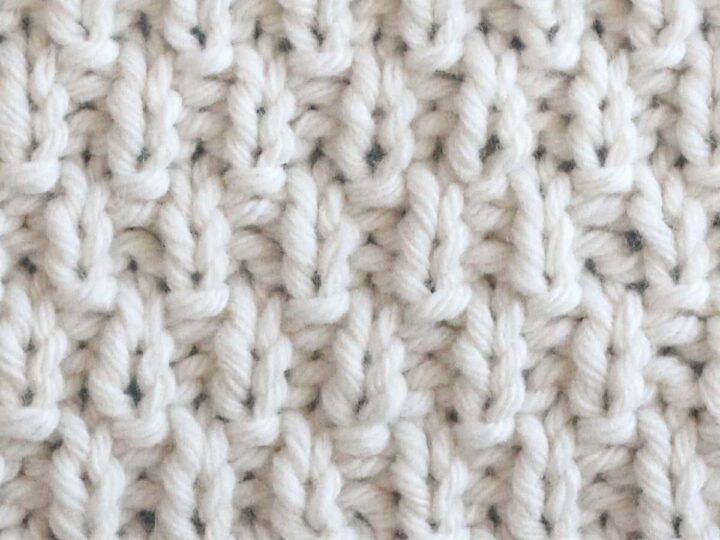 Swift Stitch knitting texture in white yarn.