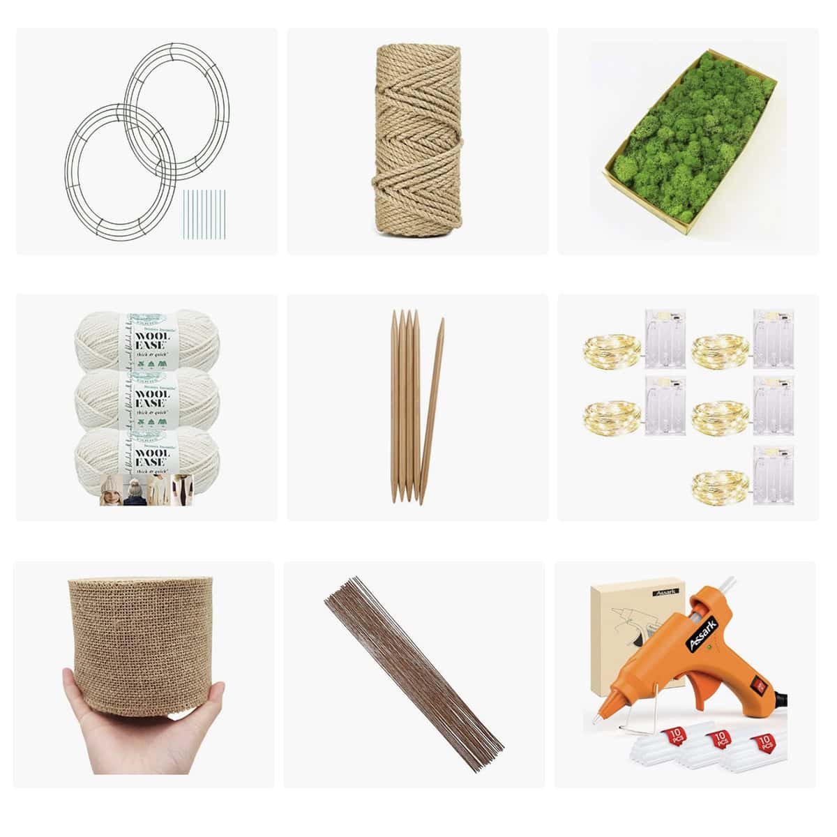 Tree of Life wreath craft supplies including wire wreath frames, jute rope, preserved moss, chunky yarn, knitting needles, fairy lights, burlap ribbon, floral wire, and hot glue gun.