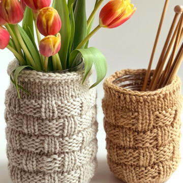 Basketweave Mason Jar Cozies styled with tulips and knitting needles for home décor and storage.
