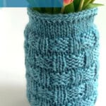 Blue Basketweave Mason Jar Cozy holding fresh tulips in a wide-mouth mason jar.